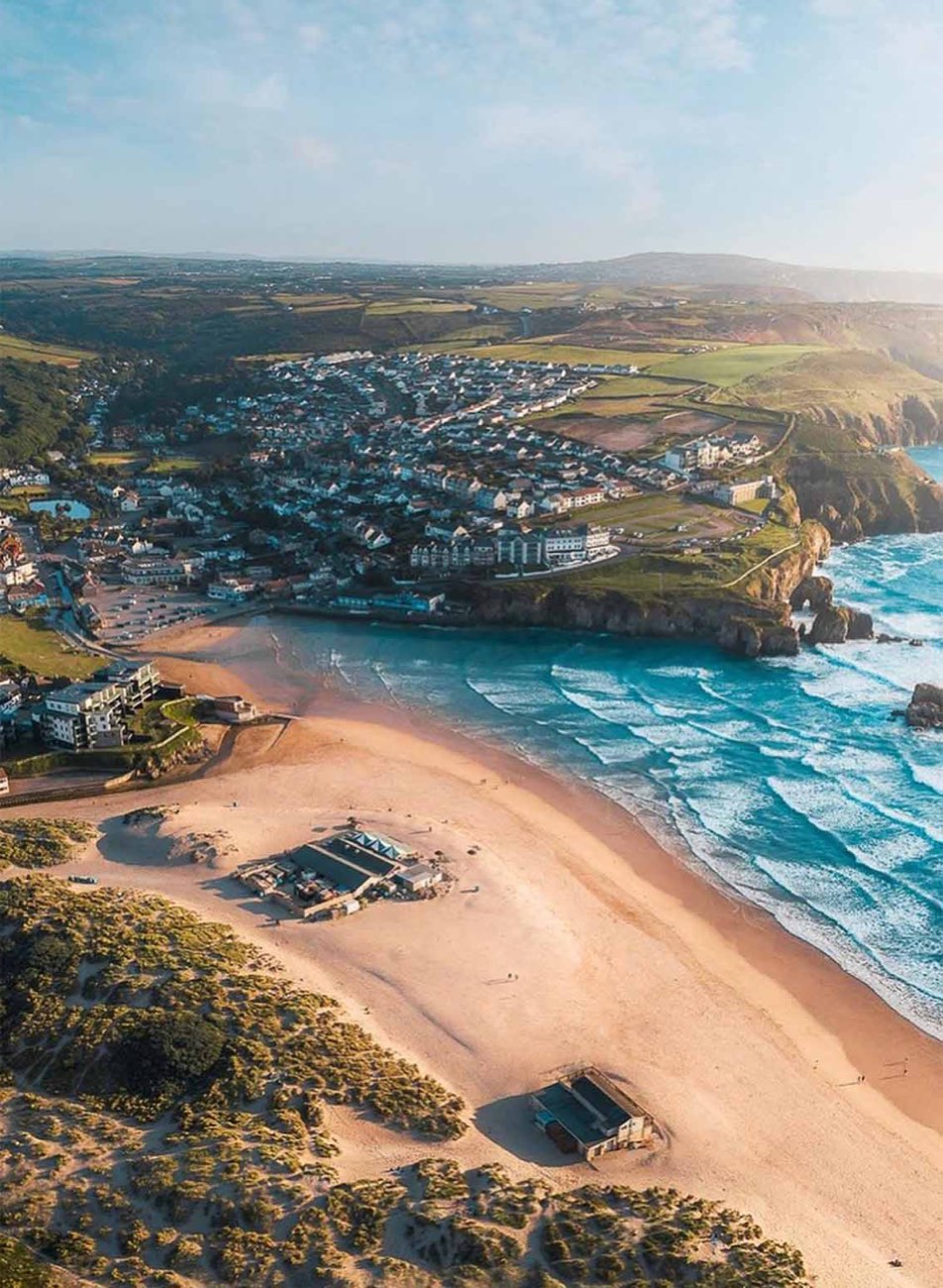 Aerial view of Perranporth beach with The Watering Hole on the sand